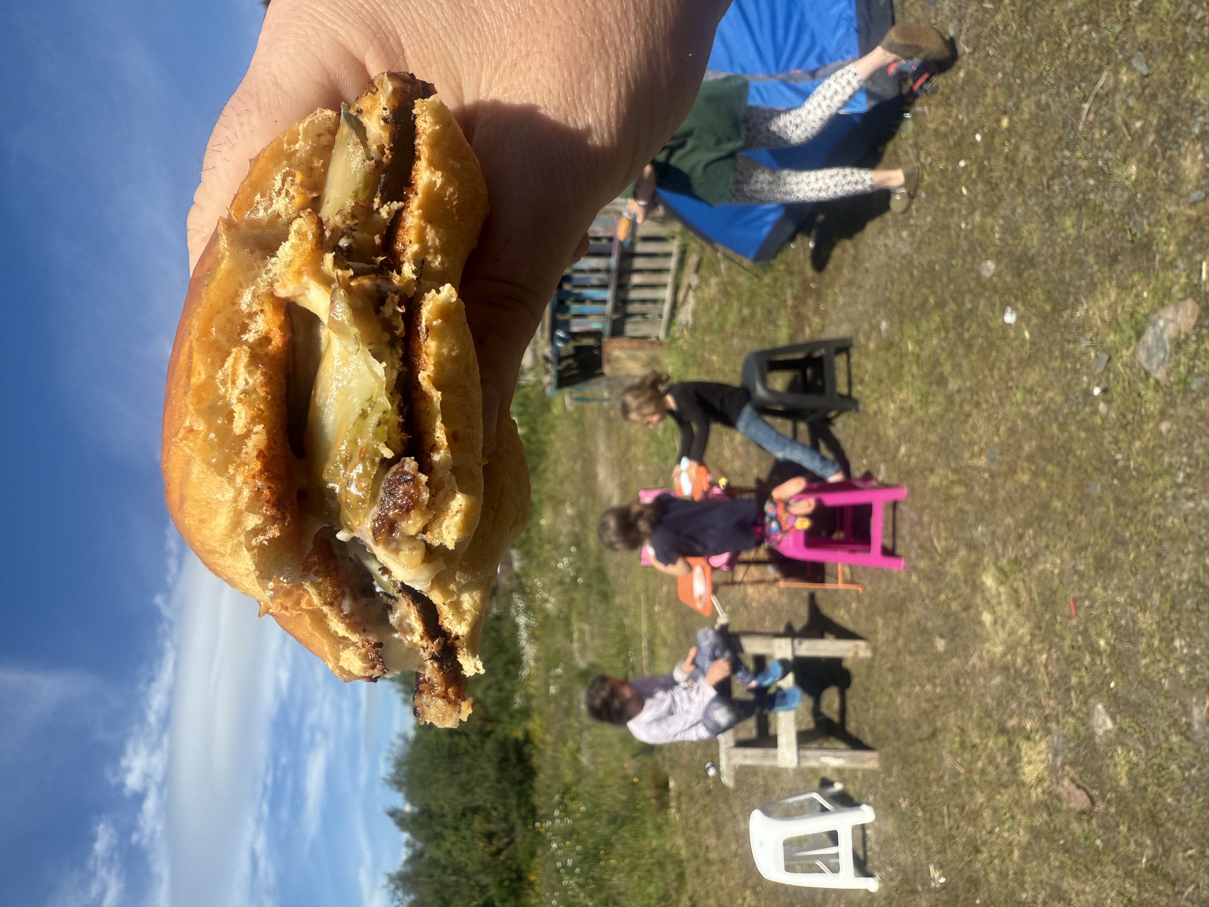 Homemade chickpea burger being eaten outside with the kids in the Scottish Highlands