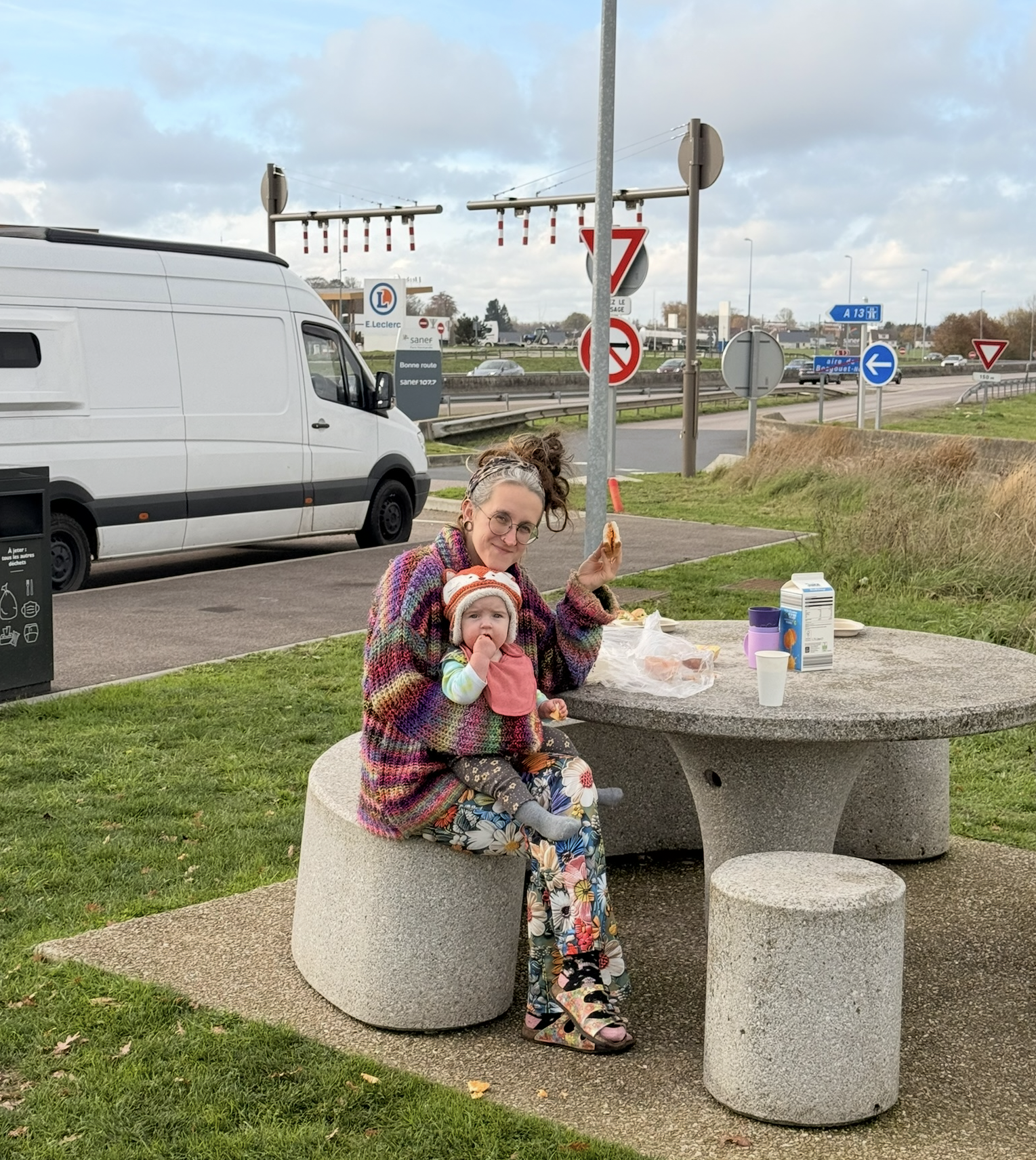 Our van with Alison sitting outside at a service station near Bordeaux, France